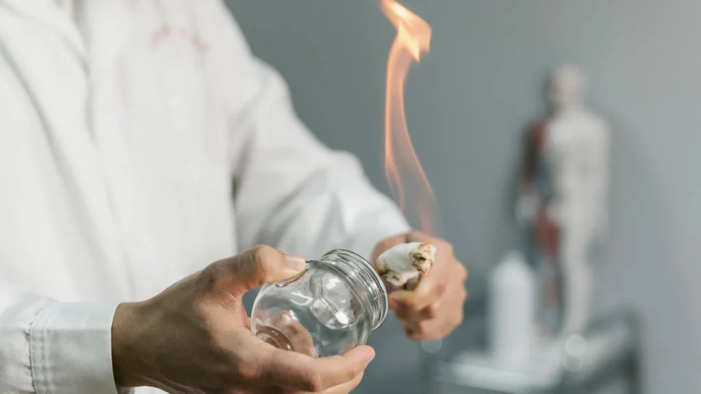 A person preparing for fire cupping