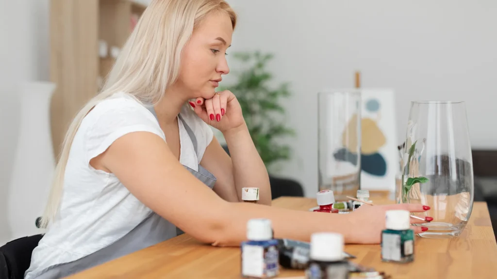 Lady sitting on her desk interatcting with therapy instruments